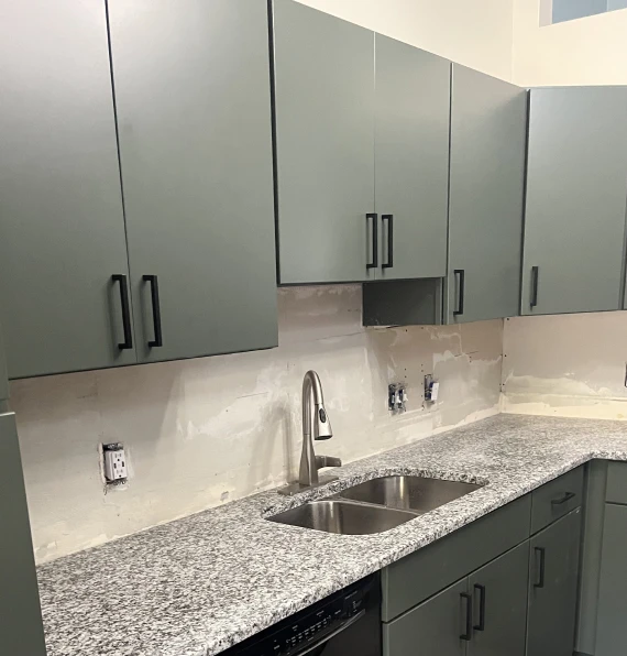 green kitchen cabinets before backsplash