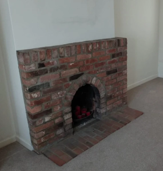 traditional red brick fireplace surround